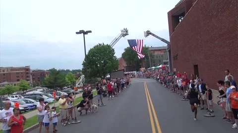 Lead runner to American Flag at finish line Video stock 52349213