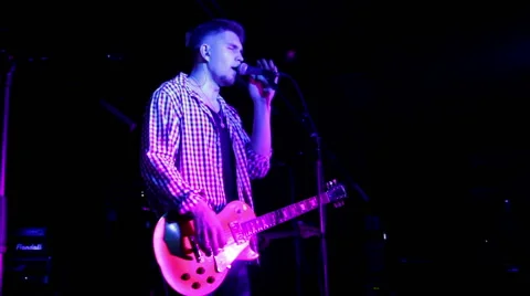 Lead singer performs on stage Stock Footage 45392208