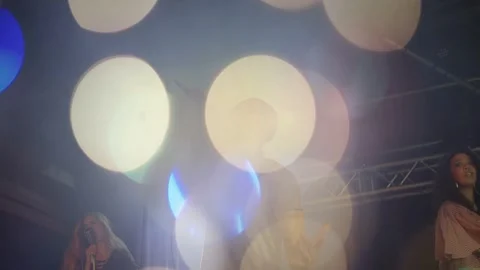 Lead singer raising arm cueing high note on music stage, duo singing bokeh 스톡 동영상 333300688