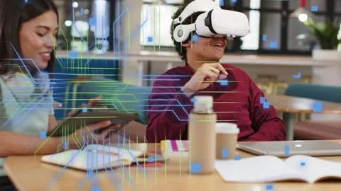 Lead student putting on white VR headset, gesturing, overlay growing around Stock Footage 334373326
