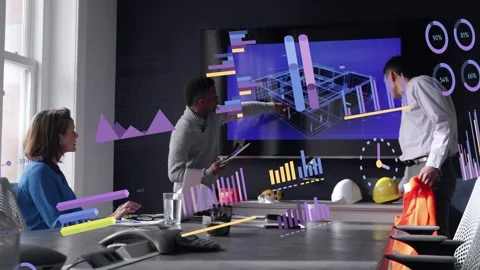 Lead tapping tablet animating 3D model and charts, engineer entering with vest Stock Footage 333447547