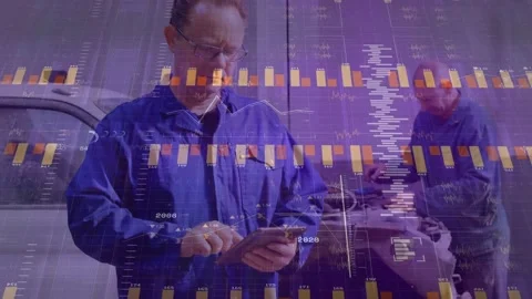 Lead tech tapping tablet, causing data growing into auto diagnostics while tech Stock Footage 334116967