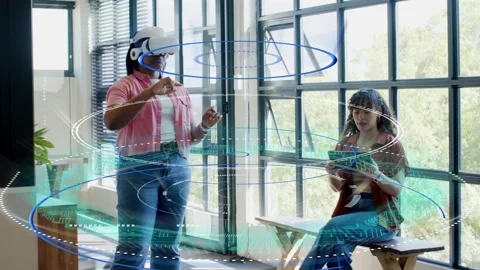 Lead with VR headset raising hands and starting holo rings while operator 스톡 동영상 329999969