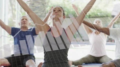 Lead woman lifting arms, class mirroring in fitness studio while HUD overlay Stock Footage 333336656