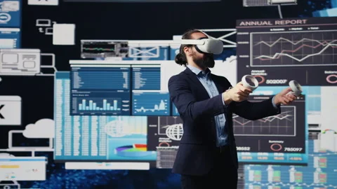 Leader does data driven planning with VR device set for successful strategy Stock Footage 311308073