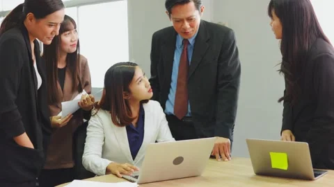 Leader proposing problem solution strategy to coworkers Stock Footage 165397596
