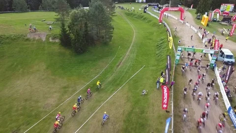 Leaders of a massed-start of the main mountain bike race at bicycle marathon Stock Footage 88491071