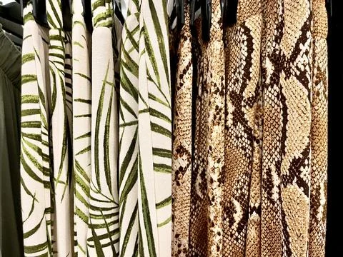 Leaf and snake pattern designs on pants rack Stock Photos