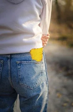 A leaf in the back pocket of jeans Stock Photos