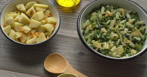 Leaf beet and boiled potatoes with fried garlic in bowls.  Country food. Stock Footage 281174179