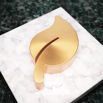 Leaf icon. Bronze Leaf symbol on white marble podium. Stock Illustration