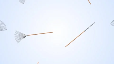 Leaf Rakes Falling on a Light Blue Background. Metal Rake with Wooden Handle. 4K Stock Footage 306883422