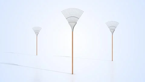 Leaf Rakes on a Light Reflective Floor. Metal Rake with Wooden Handle. 4K Stock Footage 306883432