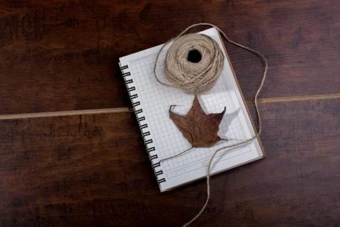 Leaf, Roll of linen string on brown background Stock Photos