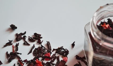 Leaf tea with pieces of fruit in a jar, scattered tea, black tea, a jar of .. Stock Photos
