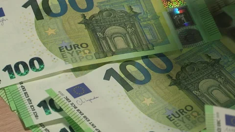 Leaf through 100 EURO banknotes on a wooden table - 38-2 Stock Footage 219640344