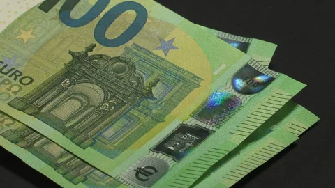Leaf through 100 EURO banknotes on a black background - 45-2 Stock Footage 219694171