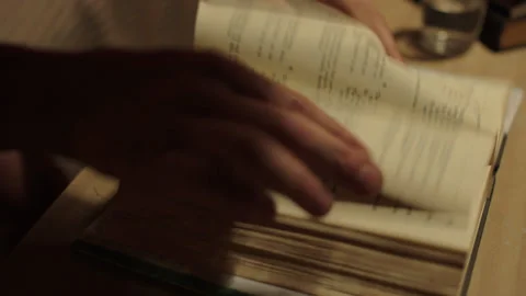 LEAFING THROUGH A BOOK Stock-Footage 140992521