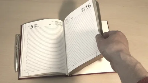 Leafing through a business book Stock Footage 76363123
