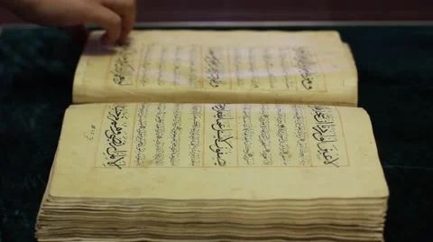 Leafing through old handwritten book in Arabic Video stock 61669265