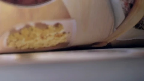 Leafing through a recipe book out of focus Stock Footage 128914833