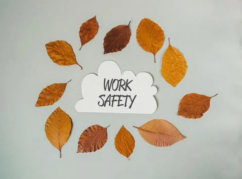 A leafy circle with the words work safety written in the center Stock Photos
