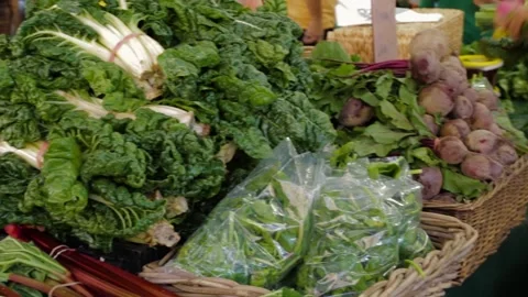 Leafy Greens and Root Vegetables for Sale at Sydney Market Stall, Australia 2016 Stock Footage 345701549