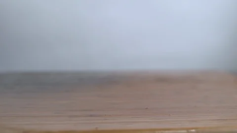 Leafy vegetables falling on chopping board in slow motion Stock Footage 100007992