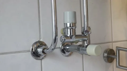 Leaking boiler pipe at home. Dripping water in apartment Stock Footage 232772307
