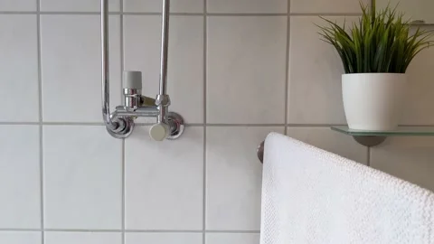 Leaking boiler pipe in modern bathroom Video stock 238725883