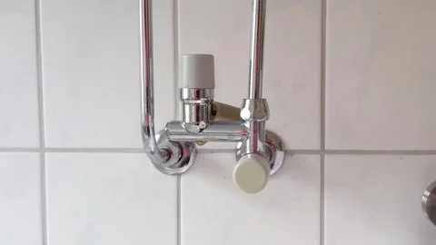 Leaking boiler pipe in modern bathroom Video stock 242602127