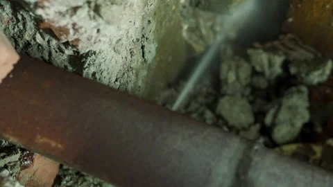 Leaking broken plumbing iron rusty pipe water splashing under pressure in house Stock Footage 139281252