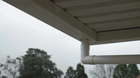 Leaking downspout (downpipe) with light rian falling Stock Footage 207600748