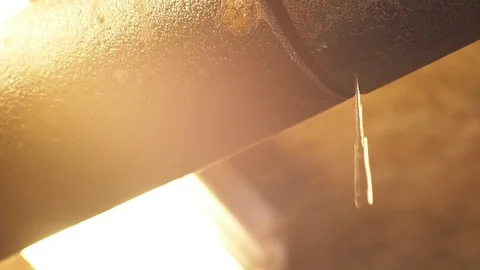 Leaking dripping pipe overhead, backlit with fill lighting Stock Footage 95815863