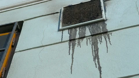 Leaking grime stains from a dirty ventilation grid on a wall Stock Footage 301243569