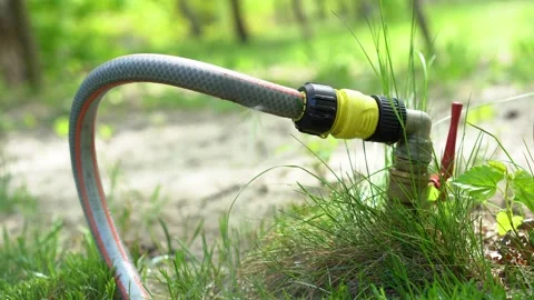 Leaking hose. Hole in the pipe, pouring waste of water Stock Footage 196164964
