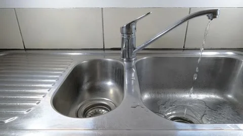 Leaking Kitchen Tap Dripping Water in Sink Stock Footage 330329314