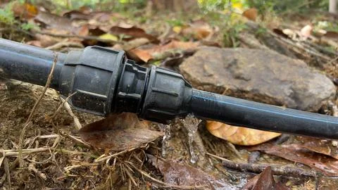 Leaking Pipe Connector in Outdoor Setting Stock Photos