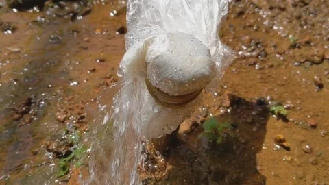 The leaking pvc water pipe was covered with white plastic Stock Footage 154937445