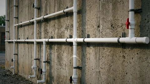 Leaking PVC water pipe zoom in Stock Footage 344828972