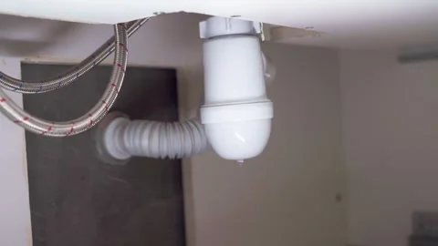 Leaking siphon in the sink. Broken siphon. Sewage leakage. Leak. Stock Footage 255890582