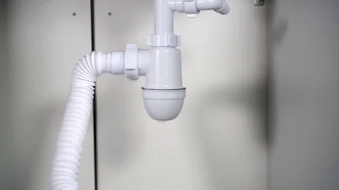 Leaking siphon under the sink Stock Footage 121482354