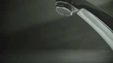 Leaking tap. Dripping water drop by drop Stock Footage 131818951