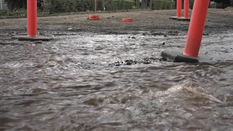 Leaking water from broken water  pipe on  new road construction Vídeo Stock 158338502