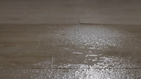 Leaking water drops that falls to the tile floor because of a broken pipe Stock Footage 210834171