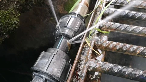 The leaks on the hdpe pipe size 1 inch on the drain have been spraying water. Stock Footage 121305845