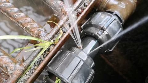 The leaks on the hdpe pipe size 1 inch on the drain have been spraying water. Stock Footage 121306033