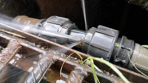 The leaks on the hdpe pipe size 1 inch on the drain have been spraying water. Stock Footage 121306108