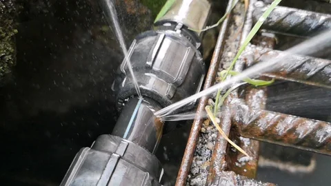 The leaks on the hdpe pipe size 1 inch on the drain have been spraying water. Stock Footage 121309083