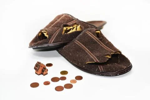 Leaky brown slippers. Stock Photos